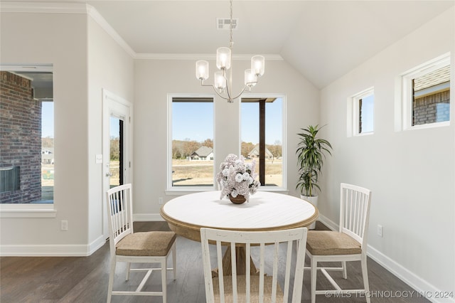 dining room featuring dark hardwood / wood-style flooring, plenty of natural light, a chandelier, and ornamental molding