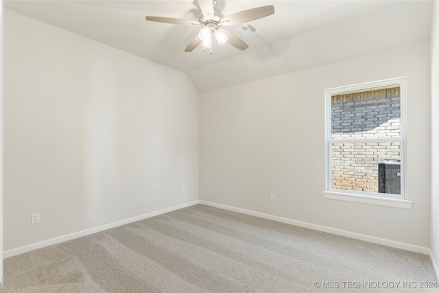 unfurnished room featuring carpet floors, ceiling fan, and lofted ceiling