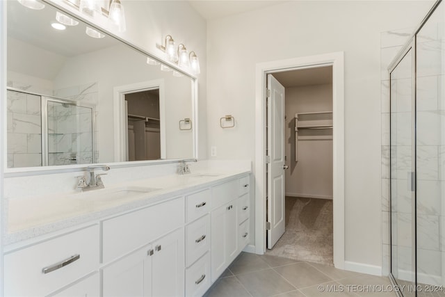 bathroom with vanity, tile patterned floors, and walk in shower