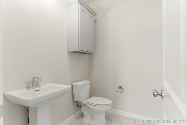 bathroom with toilet and sink