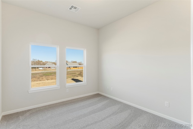 unfurnished room featuring carpet flooring