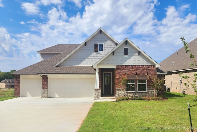 view of front facade with a front lawn and a garage