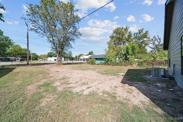 view of yard with central AC