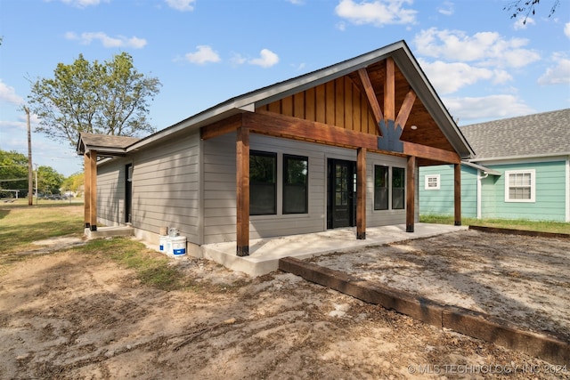 back of property featuring a patio