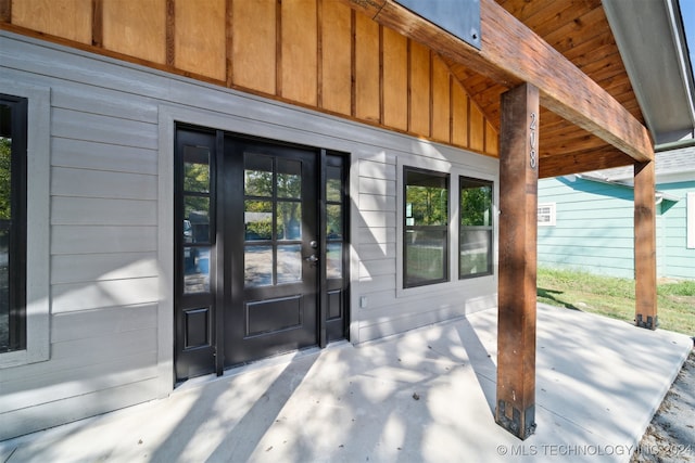 entrance to property with a patio and french doors