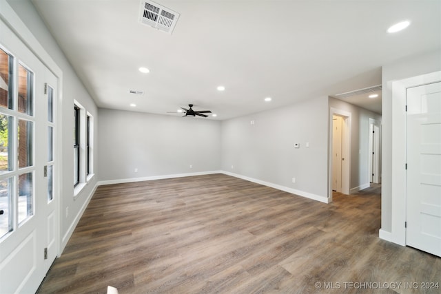 empty room featuring ceiling fan and dark hardwood / wood-style flooring