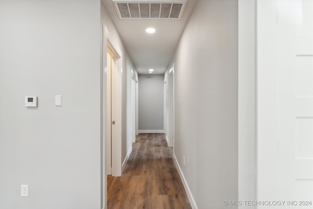 corridor featuring dark hardwood / wood-style floors