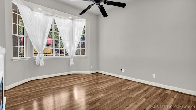 spare room featuring ceiling fan and hardwood / wood-style floors