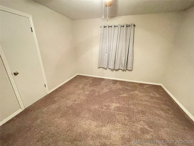 empty room with carpet and ceiling fan