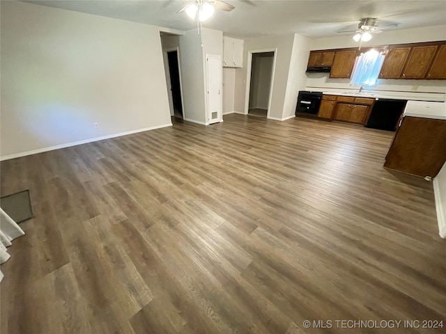 kitchen with ceiling fan, black dishwasher, dark hardwood / wood-style floors, and sink