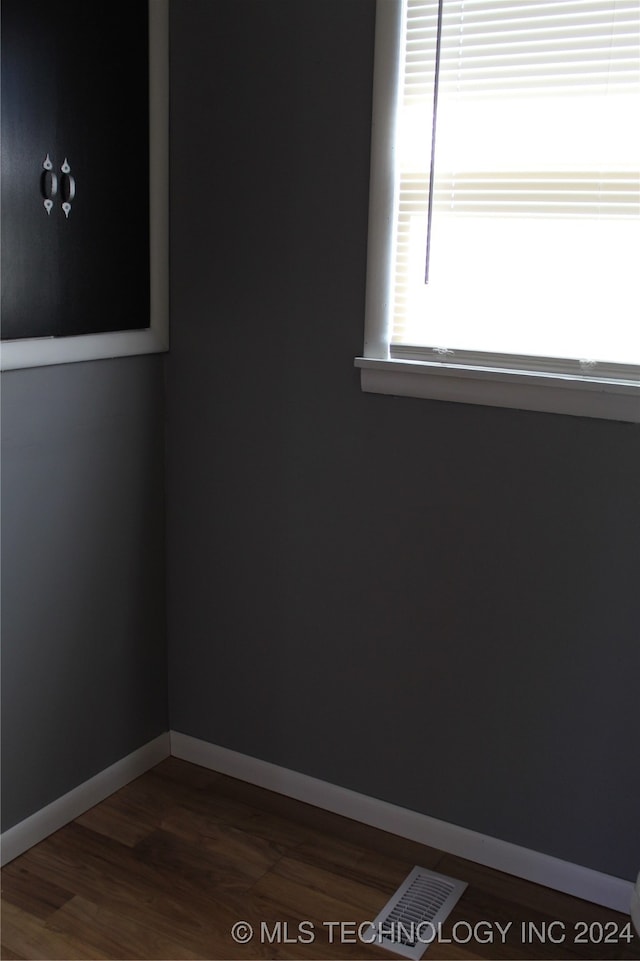 spare room featuring dark hardwood / wood-style flooring