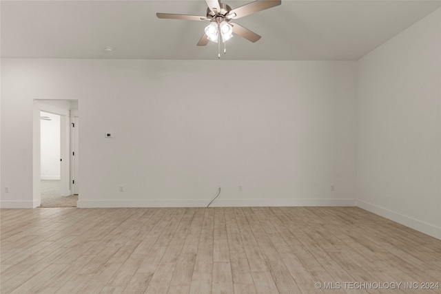 spare room with ceiling fan and light hardwood / wood-style floors