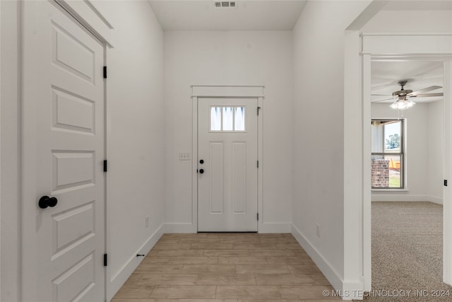 entrance foyer with light hardwood / wood-style floors and ceiling fan