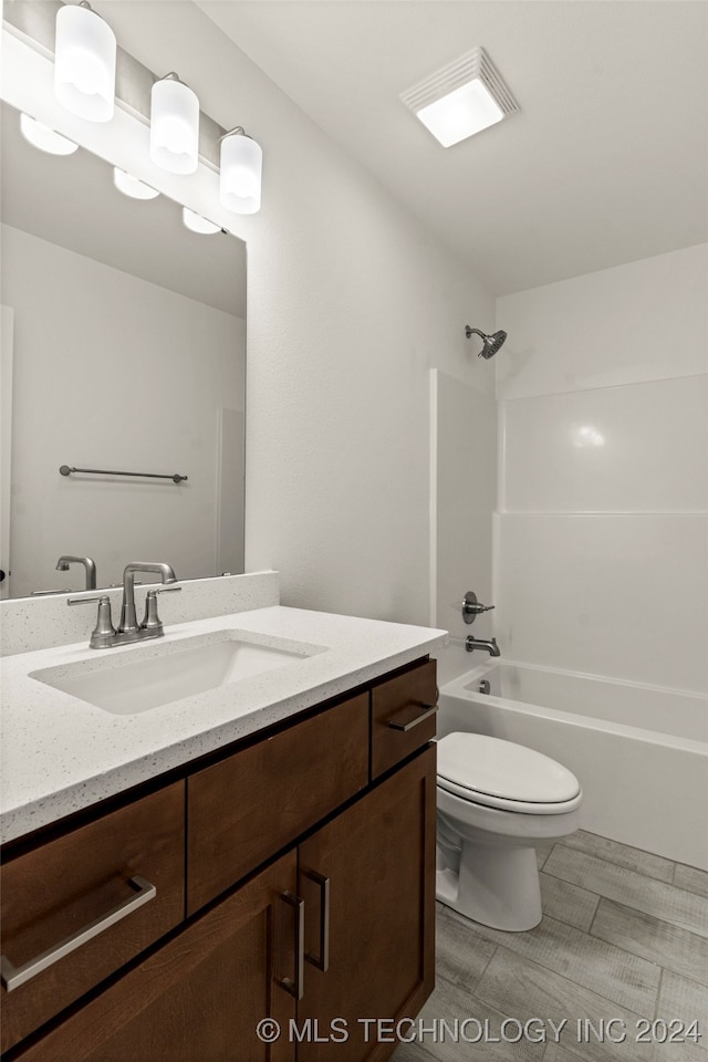 full bathroom featuring vanity, toilet, and shower / bathtub combination