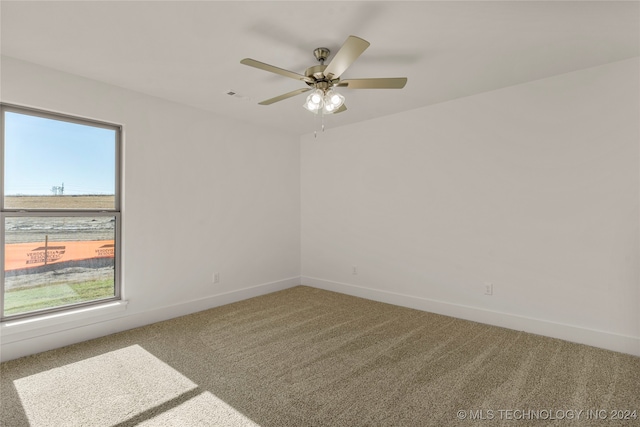 unfurnished room featuring carpet and ceiling fan