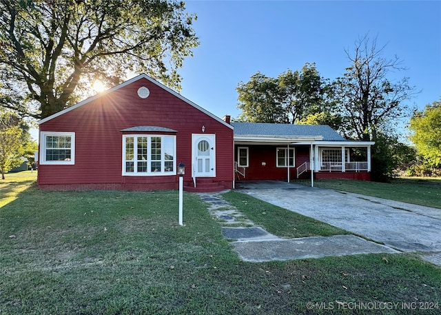 single story home with a porch and a front yard