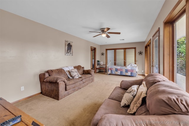 living room with ceiling fan and light carpet