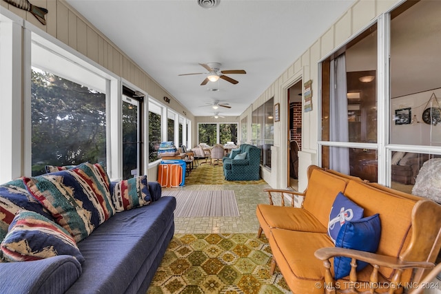 sunroom / solarium with ceiling fan