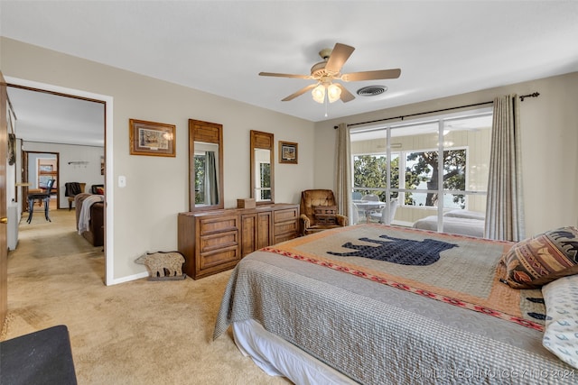 bedroom with ceiling fan and light colored carpet