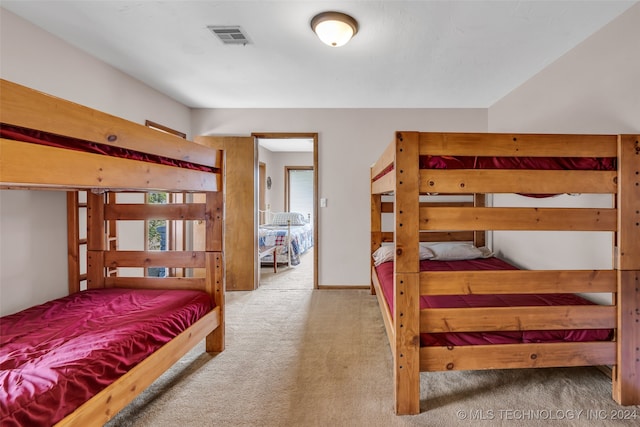 bedroom with light colored carpet