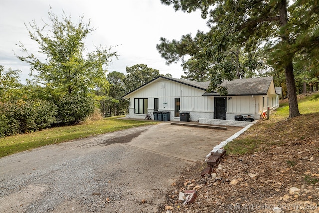 view of front of property with central air condition unit and covered porch