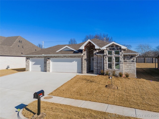 view of front of house with a front yard and a garage