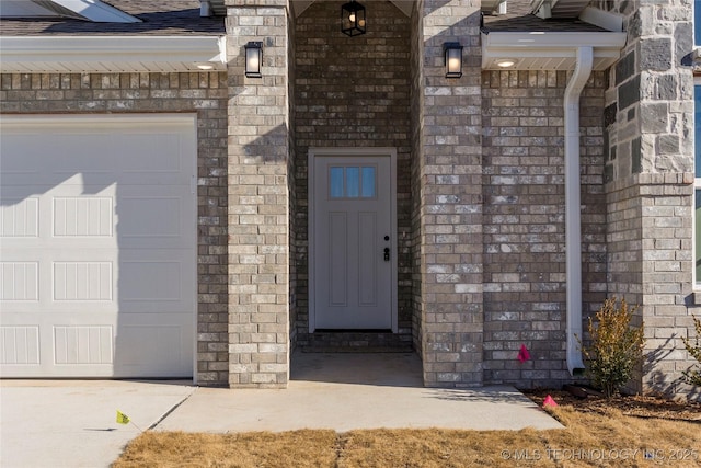 property entrance with a garage