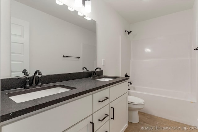 full bathroom featuring shower / bathtub combination, toilet, and vanity