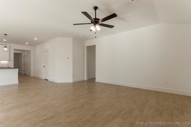 unfurnished living room featuring ceiling fan