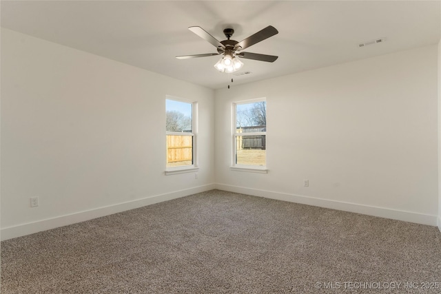 carpeted empty room featuring ceiling fan