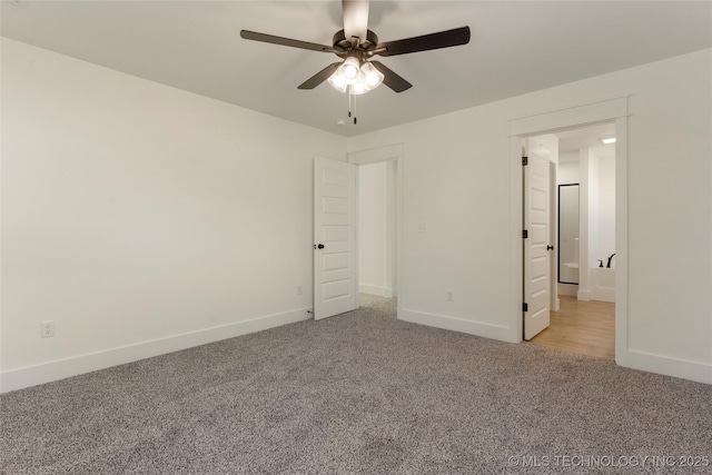 unfurnished bedroom with ceiling fan and light colored carpet