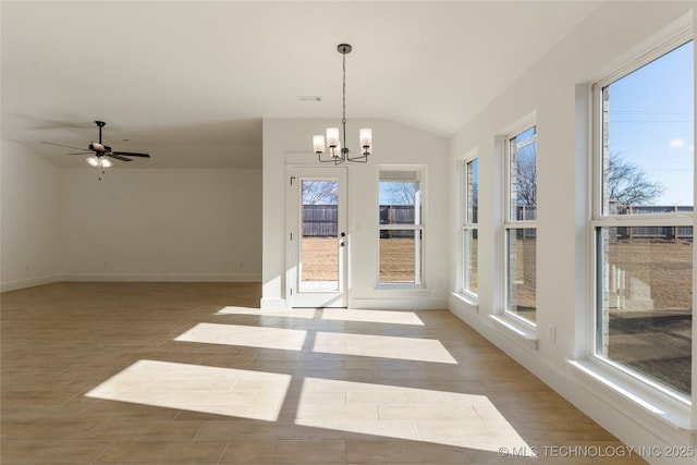 interior space featuring vaulted ceiling, a healthy amount of sunlight, ceiling fan with notable chandelier, and light hardwood / wood-style floors