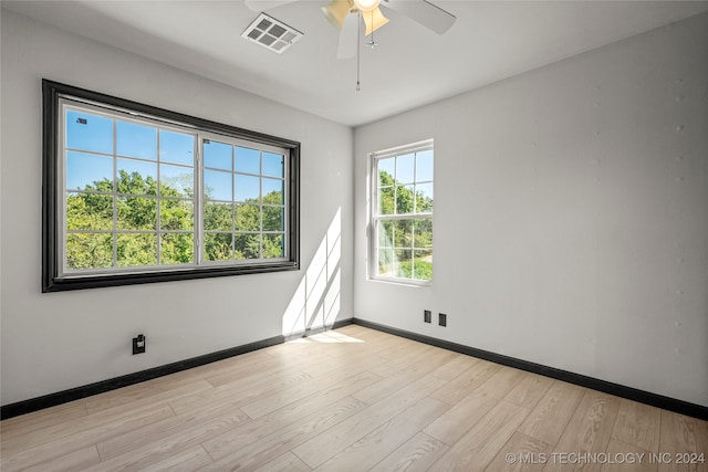 unfurnished room featuring ceiling fan and light hardwood / wood-style floors