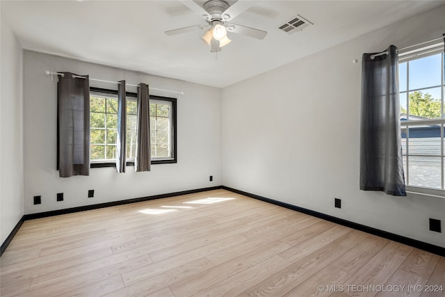 unfurnished room featuring light hardwood / wood-style floors and ceiling fan