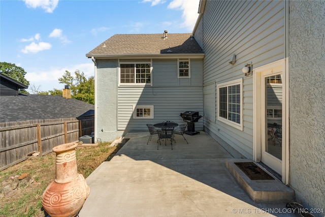 rear view of property featuring a patio