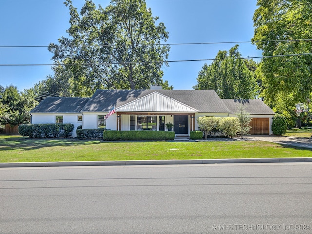 ranch-style home with a front yard