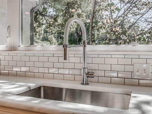 room details with backsplash and sink