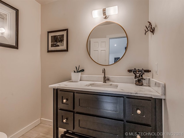 bathroom featuring tile patterned flooring and vanity