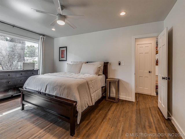 bedroom featuring dark hardwood / wood-style flooring and ceiling fan