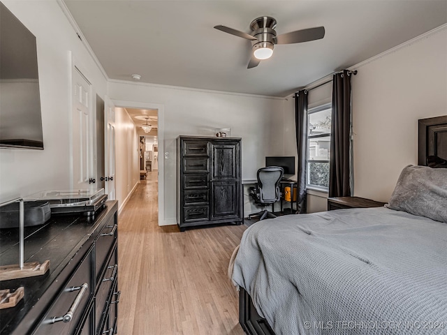 bedroom featuring light wood-type flooring, ceiling fan, and crown molding