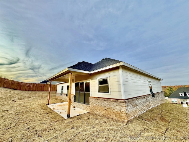 back of house with a patio