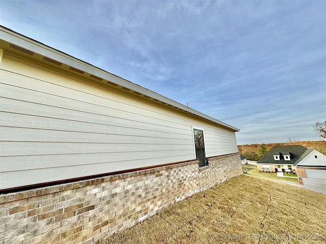 view of property exterior featuring a yard