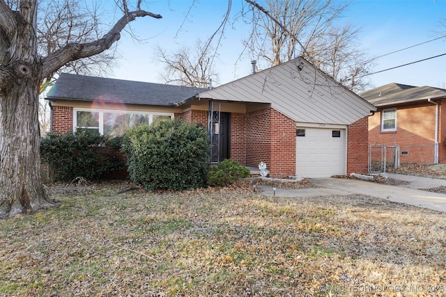 ranch-style house featuring a garage