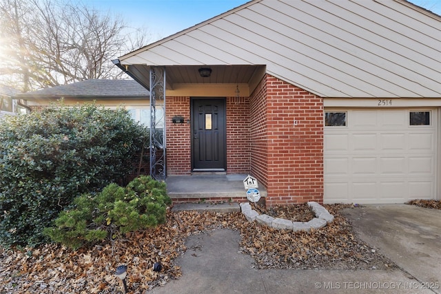 view of exterior entry featuring a garage