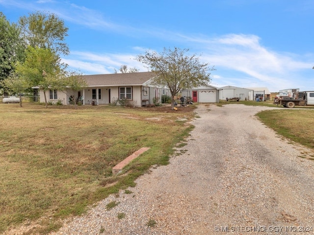 ranch-style house with a garage and a front yard