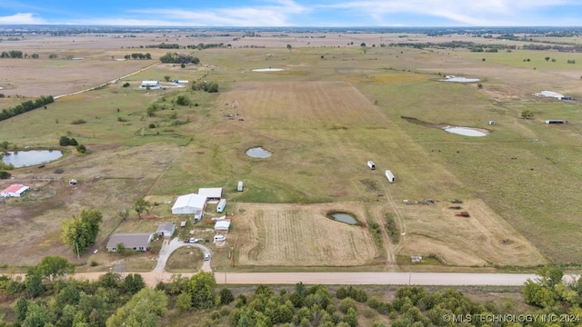 aerial view featuring a water view and a rural view