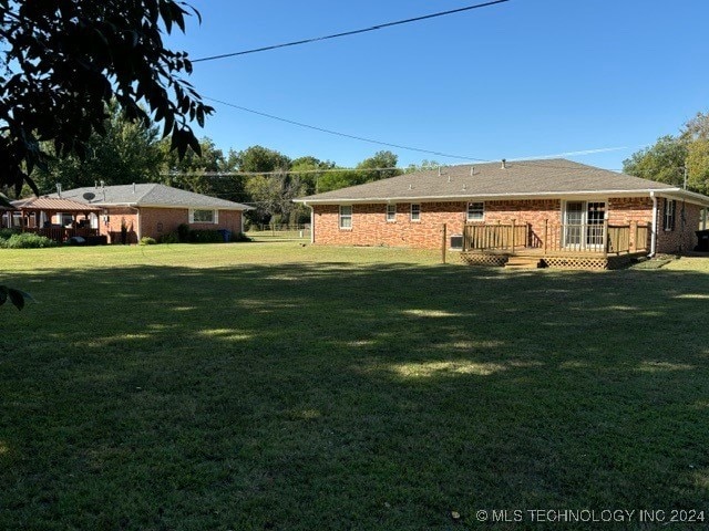 view of yard featuring a deck