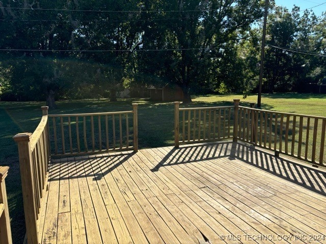 deck featuring a lawn