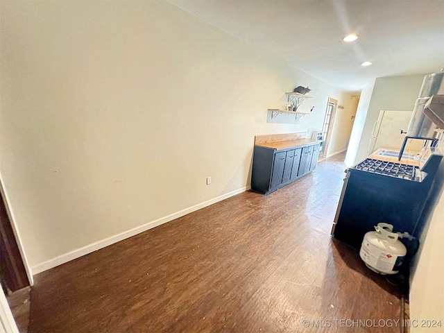 unfurnished living room featuring dark wood-type flooring