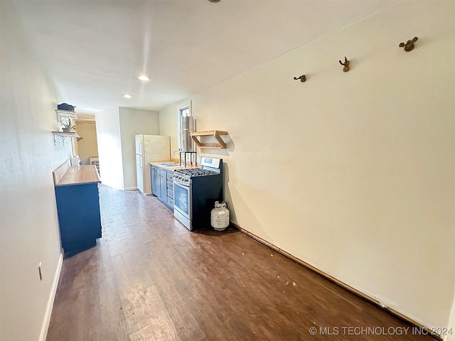 corridor featuring dark wood-type flooring and sink